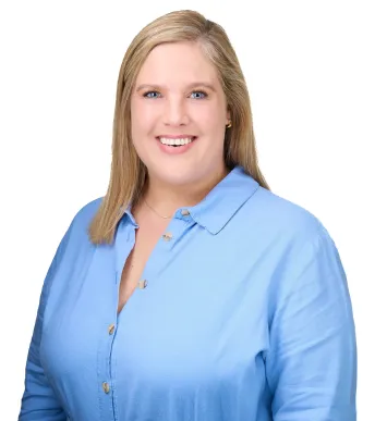 staff member working at TPTC, standing posing for a professional picture wearing a professional outfit.