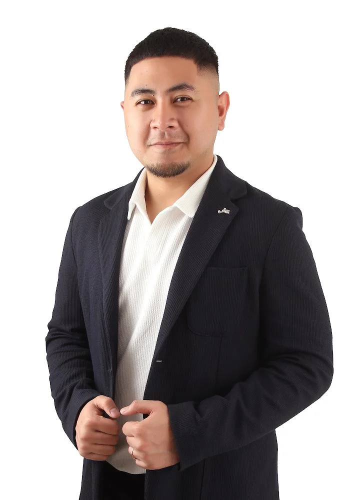 Clinician staff member working at TPTC, standing posing for a professional picture wearing a professional outfit.