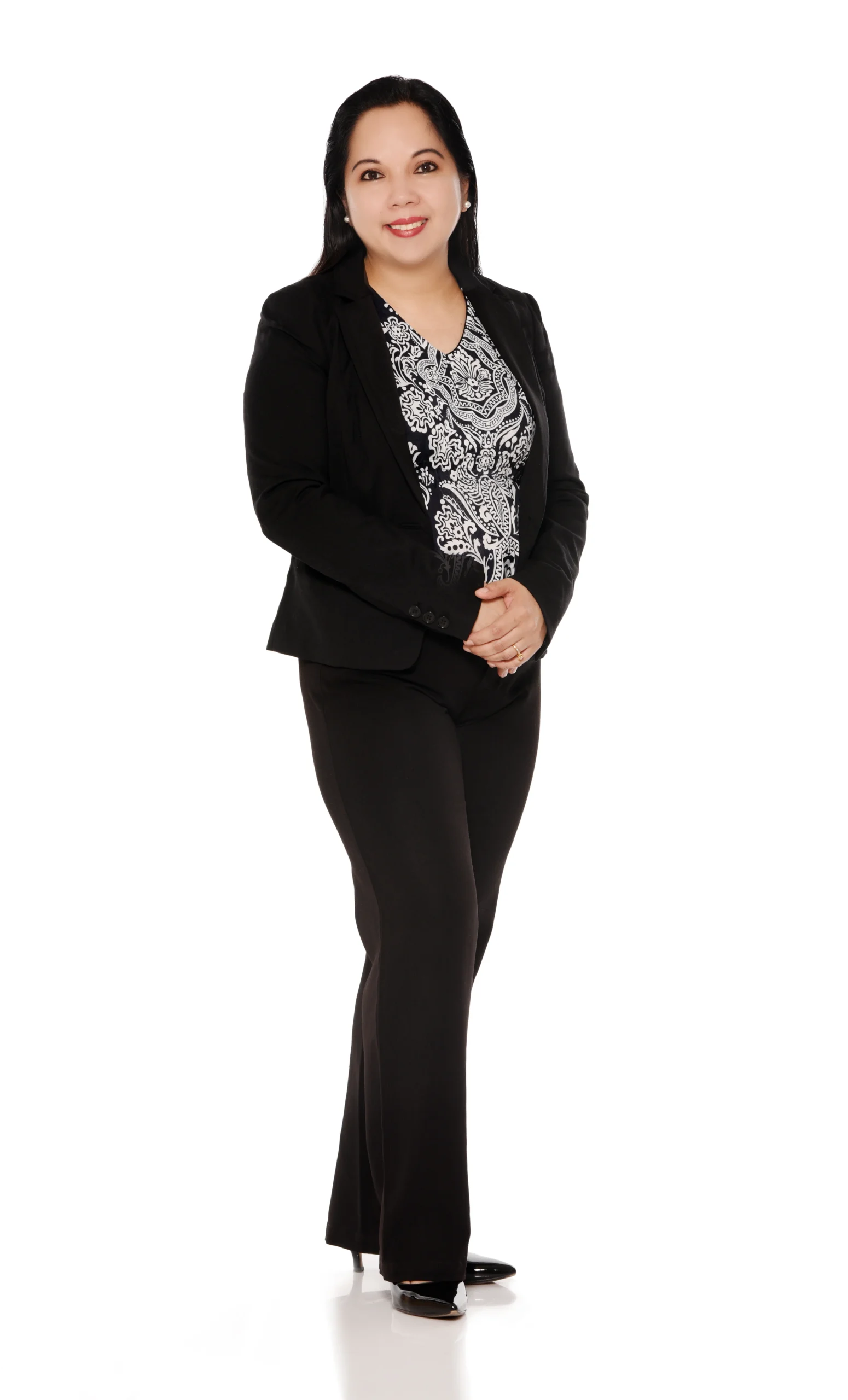 Clinician staff member working at TPTC, standing posing for a professional picture wearing a professional outfit.