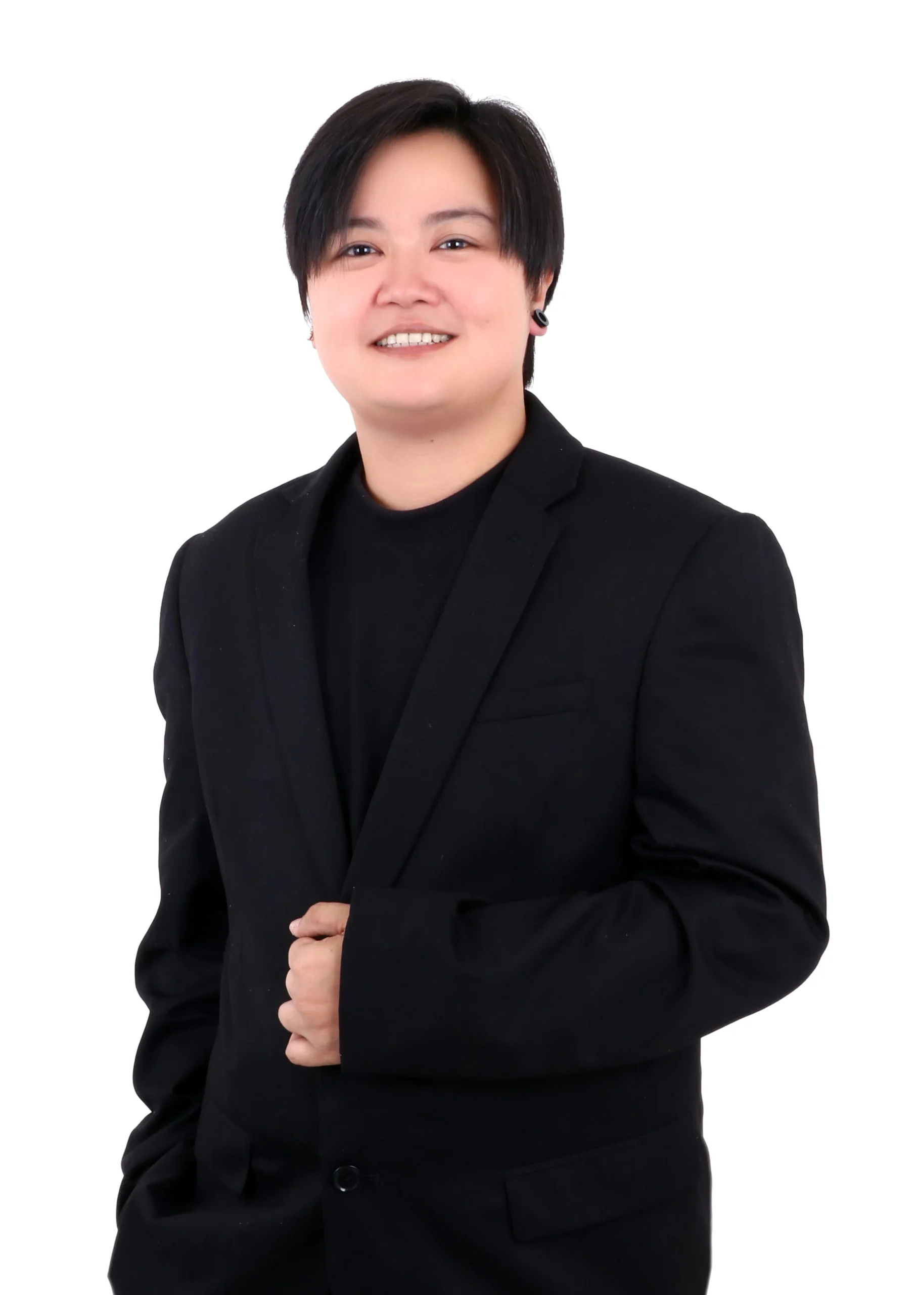 staff member working at TPTC, standing posing for a professional picture wearing a professional outfit.