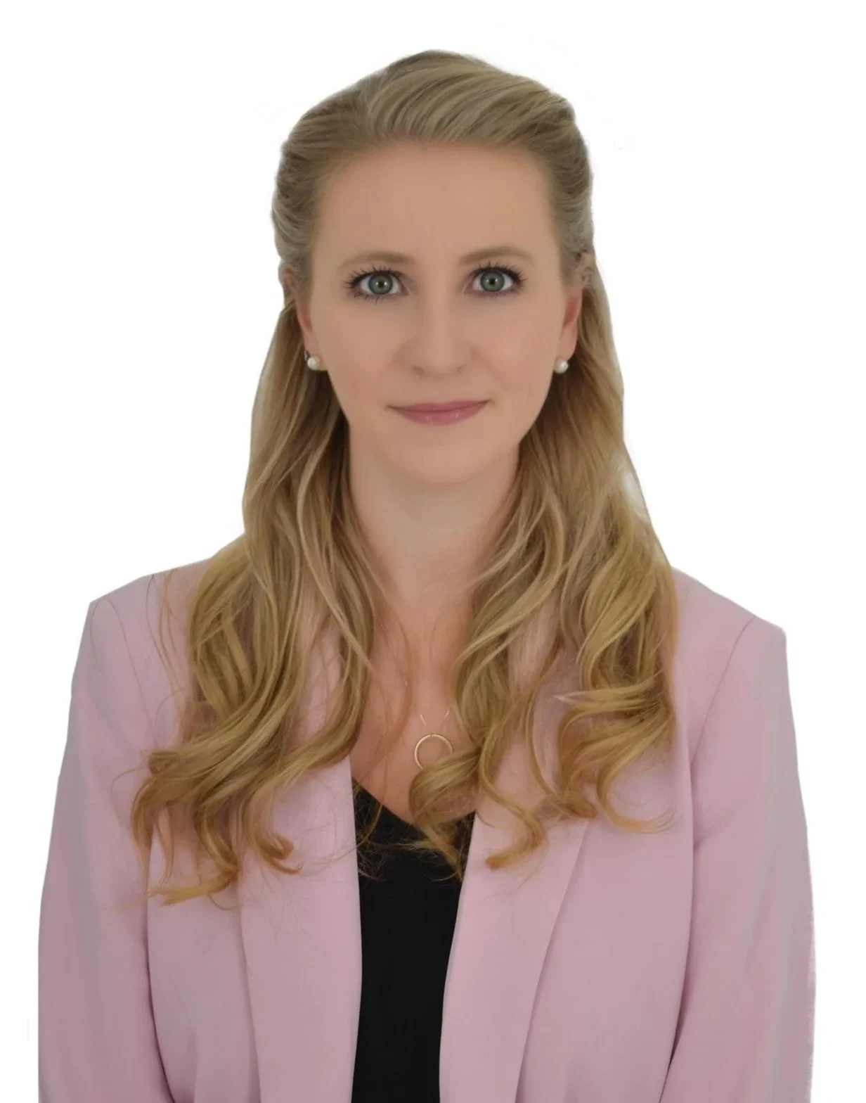 staff member working at TPTC, standing posing for a professional picture wearing a professional outfit.